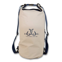 Beige dry bag with roll-top closure, DECKHAND logo, and adjustable straps