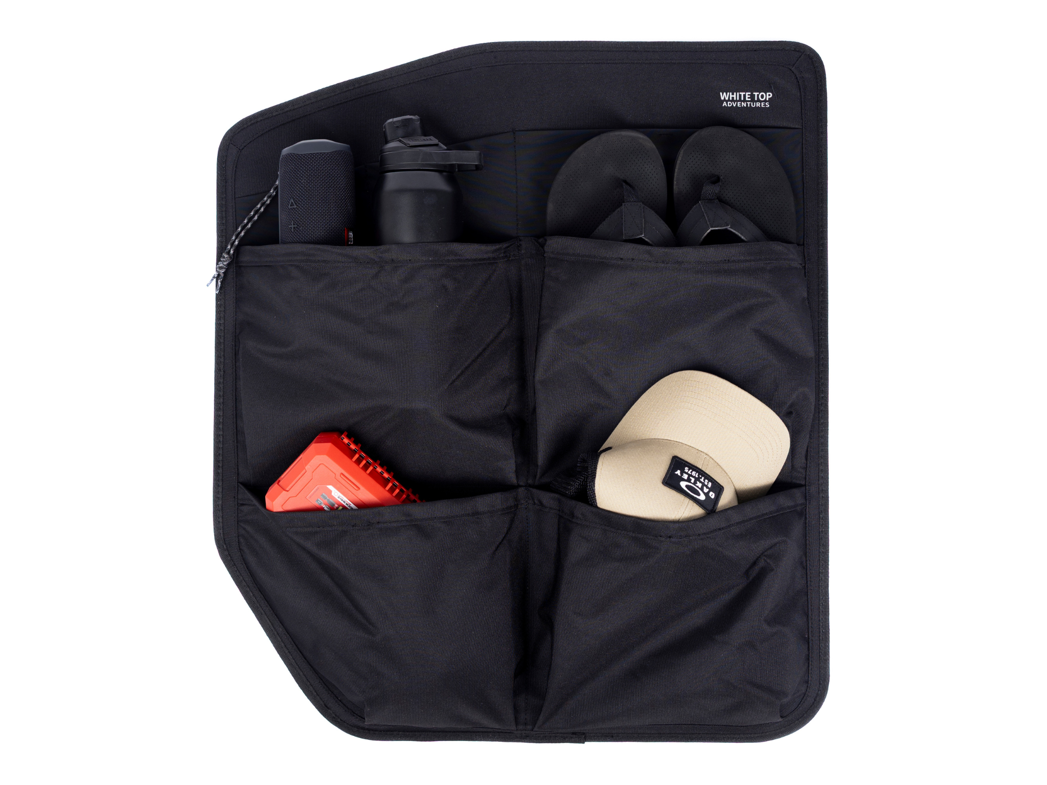 Black rear door storage panel with two interior compartments and mesh divider