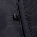 Black fabric storage panel edge with reinforced seam and woven loop detail