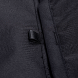 Black fabric storage panel edge with reinforced seam and woven loop detail