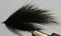 Black and gray pine squirrel leech fly lure with hackle tail on hook