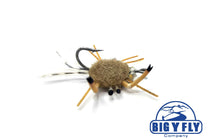 Fishing fly lure, tan fuzzy crab with black eyes and metal hook