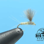 Fishing lure fly with dark body and tan CDC-style feather wing on hook