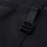 Black storage panel strap buckle/connector detail on textured fabric