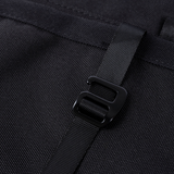 Black storage panel strap buckle/connector detail on textured fabric