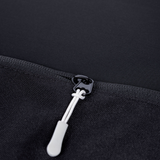 Black storage panel zipper with white pull and loop puller