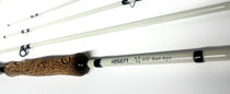 Fly fishing rod and reel combo with wood-grain handle and light gray rod sections