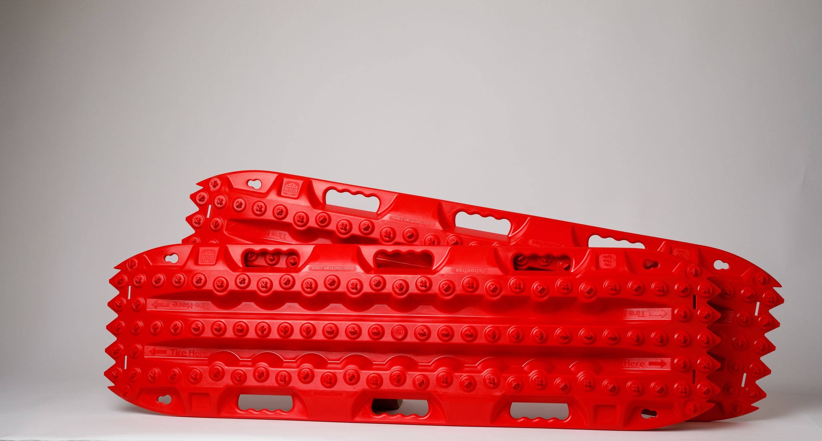 Red traction recovery boards, pair with studded tread surface