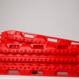 Red traction recovery boards, pair with studded tread surface