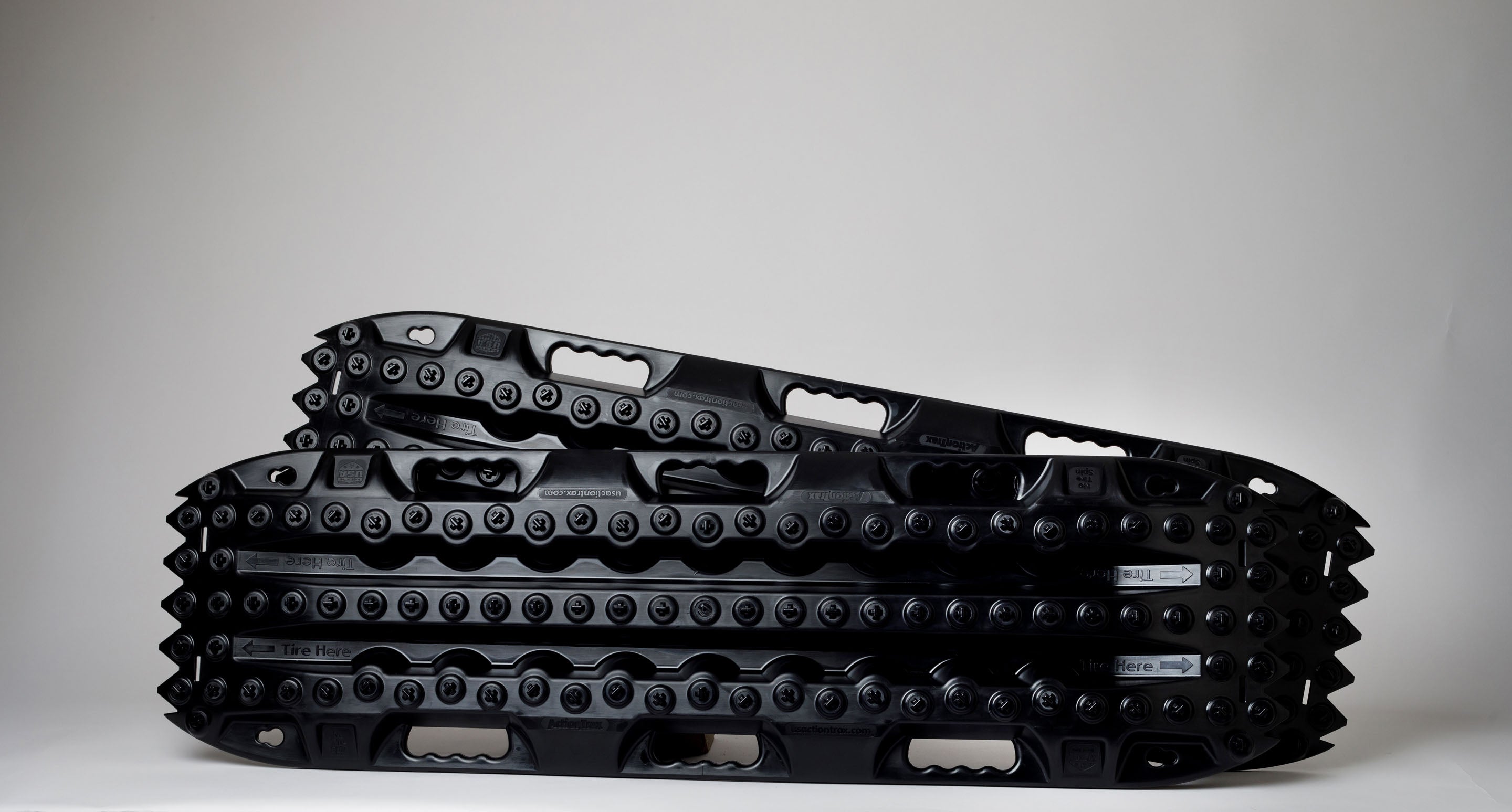 Black off-road traction recovery boards (pair) with studded tread surface