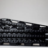 Black off-road traction recovery boards (pair) with studded tread surface