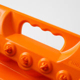 Orange traction recovery board handle cutout with stud bolts