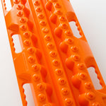Orange traction recovery board with long grooves and molded tread buttons