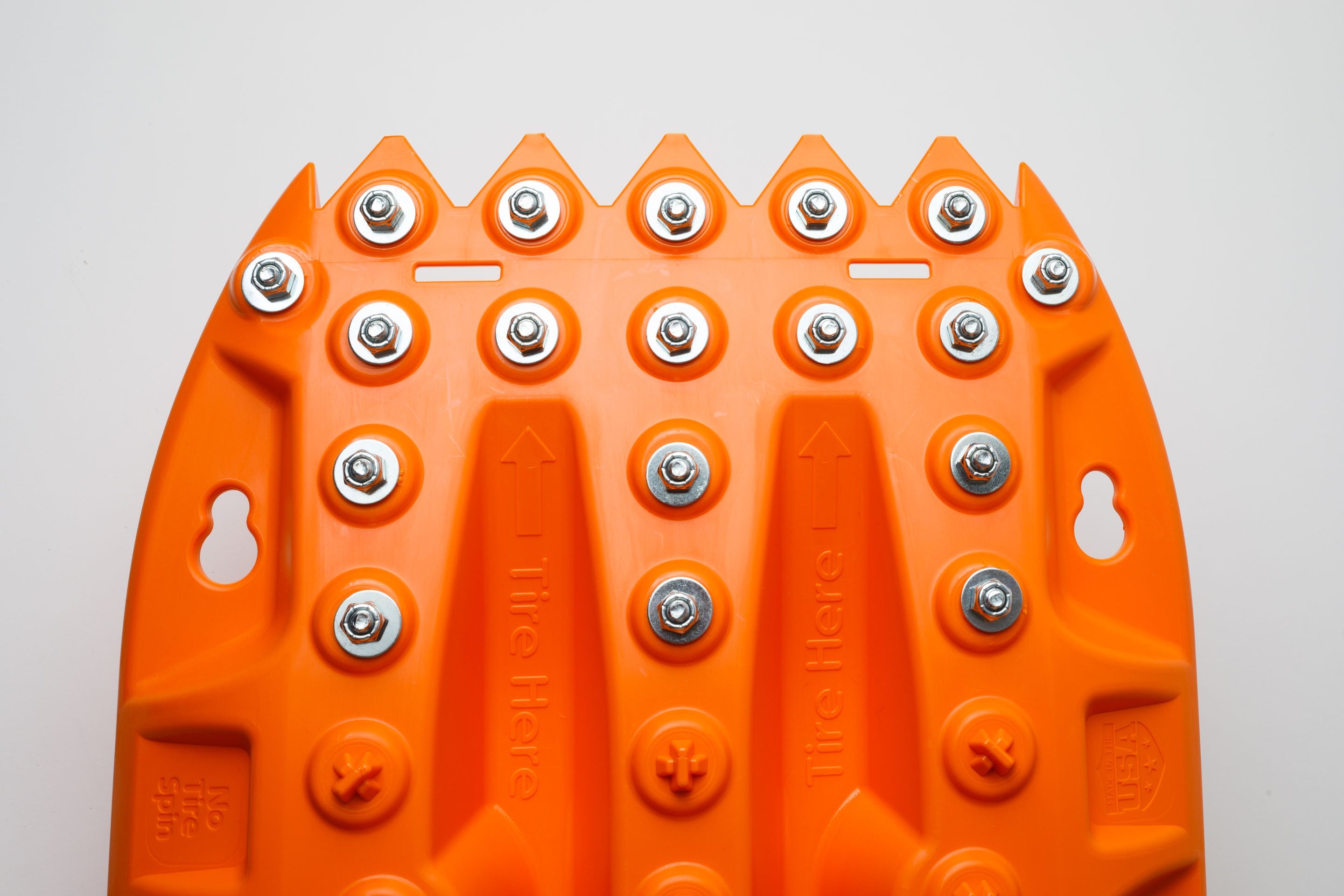 Orange metal-tooth recovery board, close-up of studbed surface