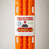 Orange metal-teeth recovery traction board shown on retail packaging