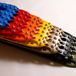 Studded traction recovery board pair in blue, red, yellow, and black