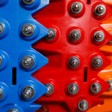 Close-up of blue and orange traction teeth with steel bolts