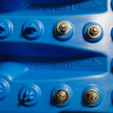 Close-up of blue traction mat with metal bolts on grip surface