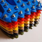 Blue traction recovery boards stack with metal studs and bolts