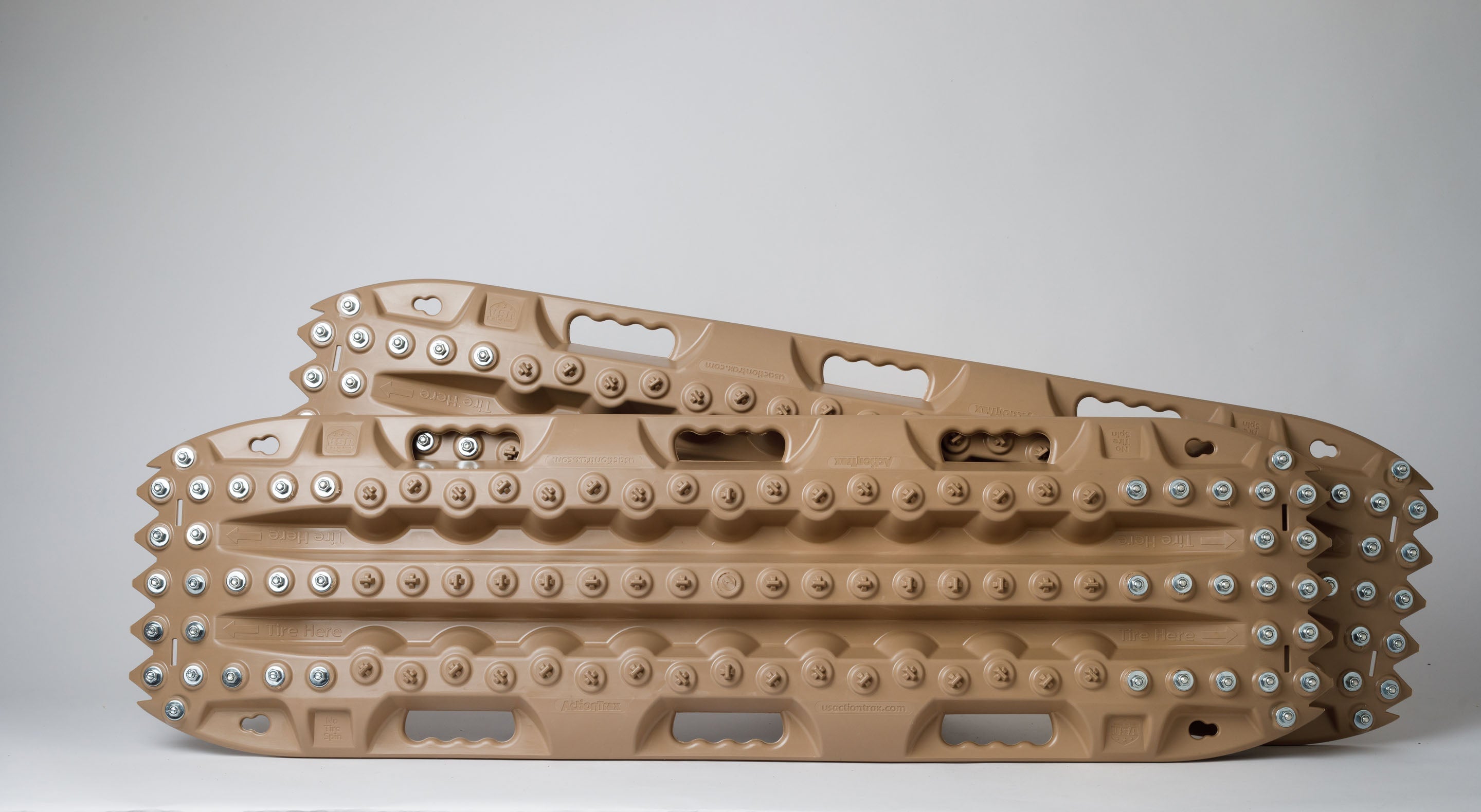 Tan recovery traction mat with metal teeth studs, arched tread design