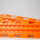 Orange traction recovery board pair, side view with metal studs