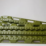 OD green metal-tooth recovery traction board, side view with studded edges