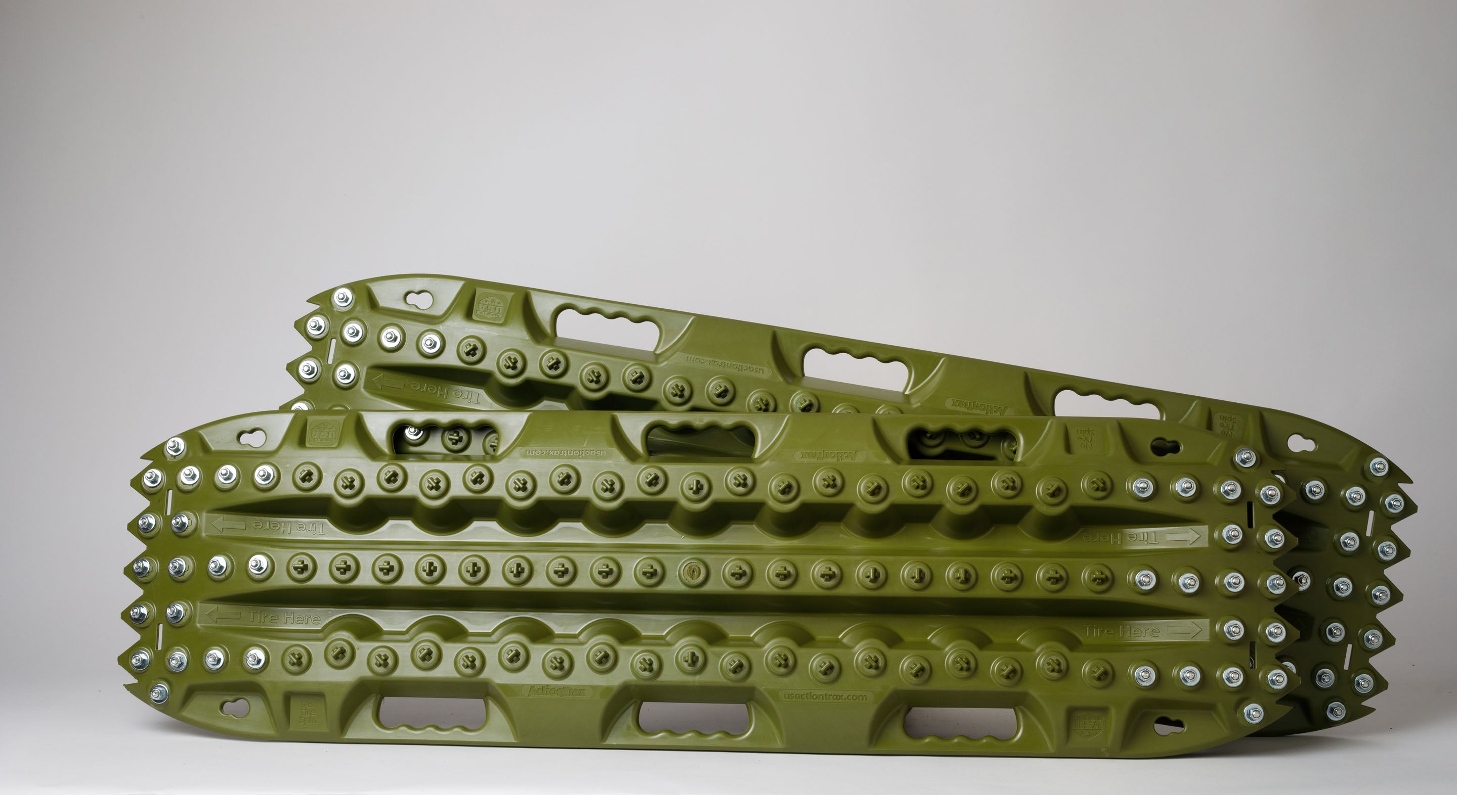 OD green metal-tooth recovery traction board, side view with studded edges