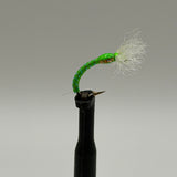 Chironomid buzzer fly lure on black stem, bright green body, white feather tail, barbed hook