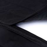 Black privacy curtain seam close-up with double-stitched edge binding