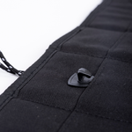 Black privacy curtain corner with stitched fabric and plastic snap fastener