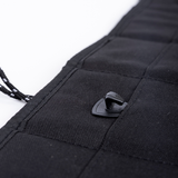 Black privacy curtain corner with stitched fabric and plastic snap fastener