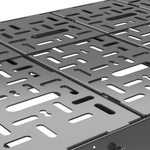 Close-up of black perforated platform with rectangular cutouts and raised edges