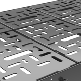 Close-up of black perforated platform with rectangular cutouts and raised edges