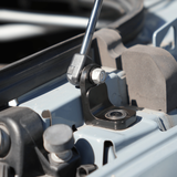 Installed hood strut on Sprinter van, showing bracket, pivot bolt, and bearing