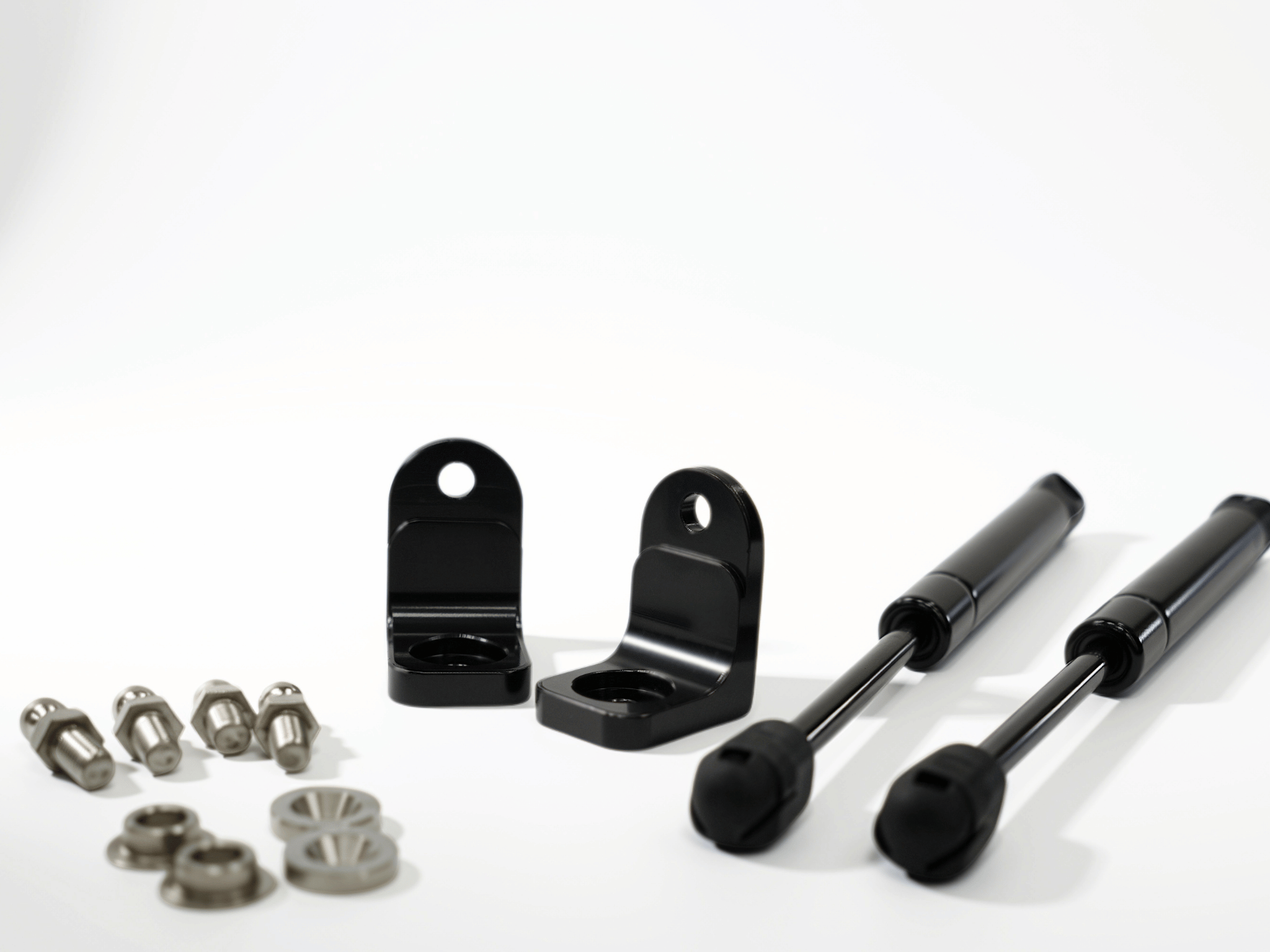 Sprinter van hood strut kit parts: two black struts, brackets, bolts, and washers