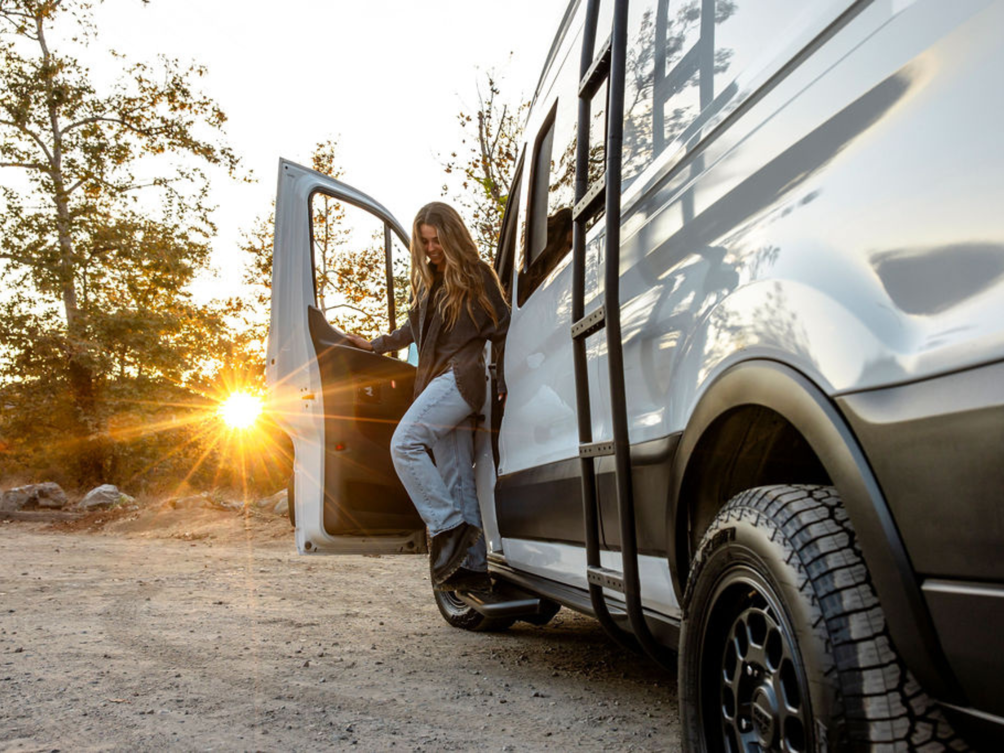 Black side step bars on a Ford Transit, ready for step-in access