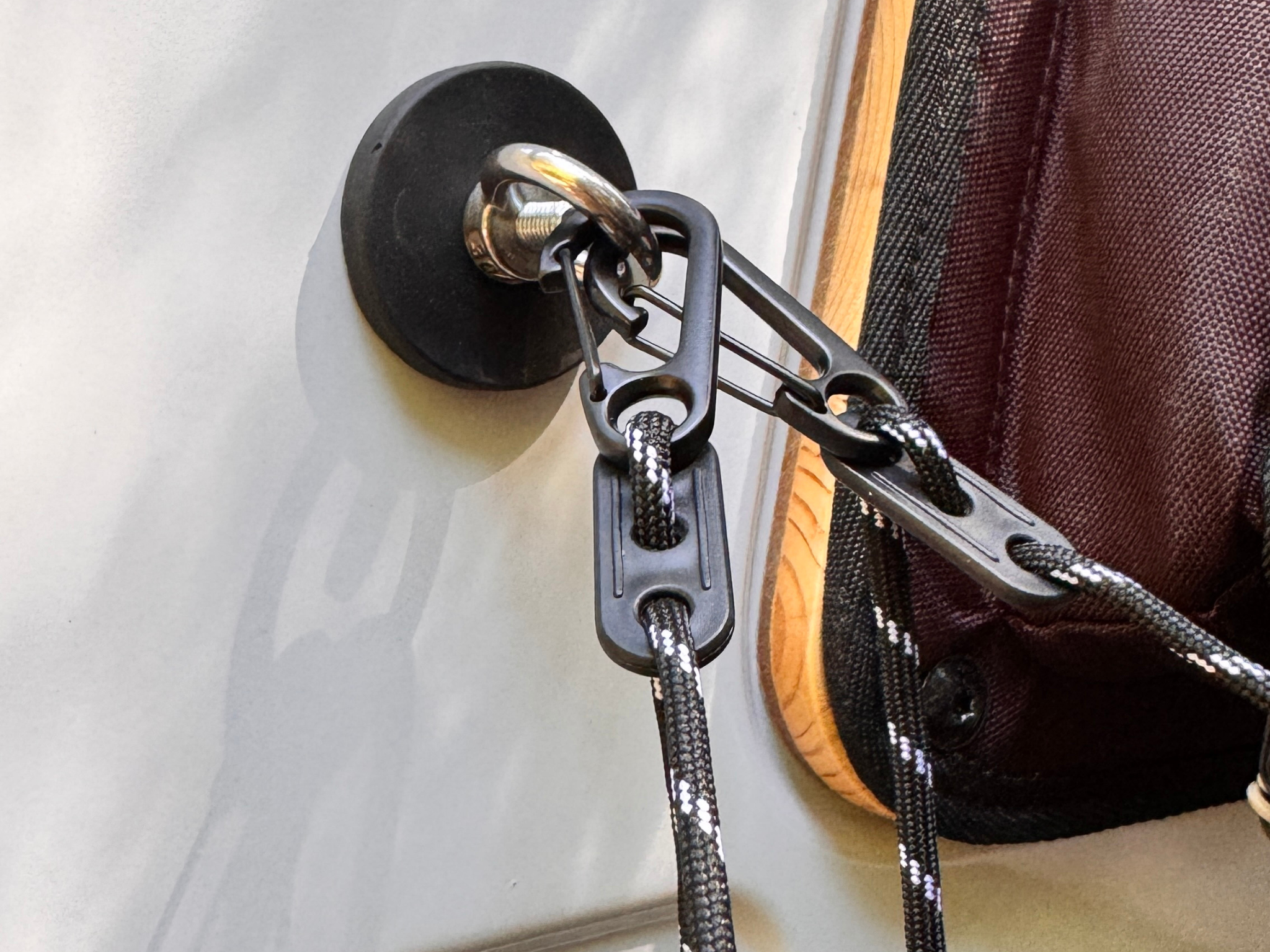 Shower kit hook hardware with black strap, carabiner clip, and braided cord