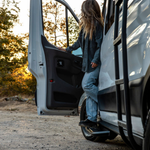Black side steps on Ford Transit van, showing angled step bar design