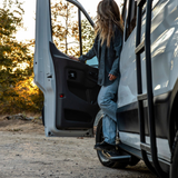 Black side steps on Ford Transit van, showing angled step bar design