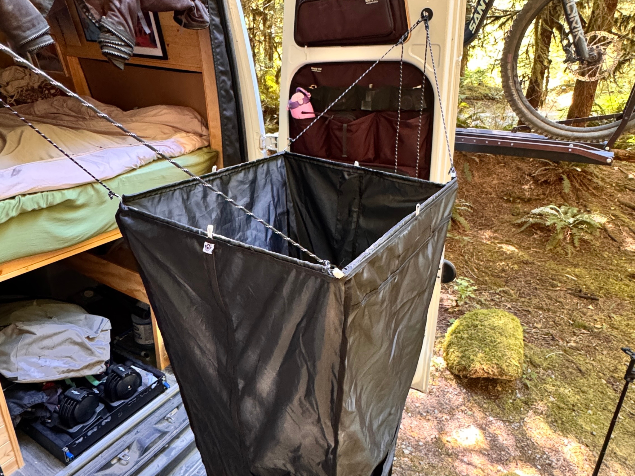 Portable shower kit with black side panels and front mesh pocket for accessories