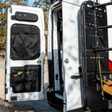Passenger-side rear door storage rack with perforated pegboard and black storage pouches