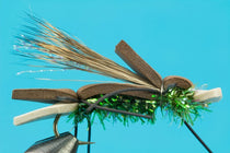 Green and black fishing fly lure with fuzzy legs and ant-style body