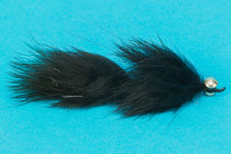 Leech fishing lure with articulated fuzzy black body and metal bead head