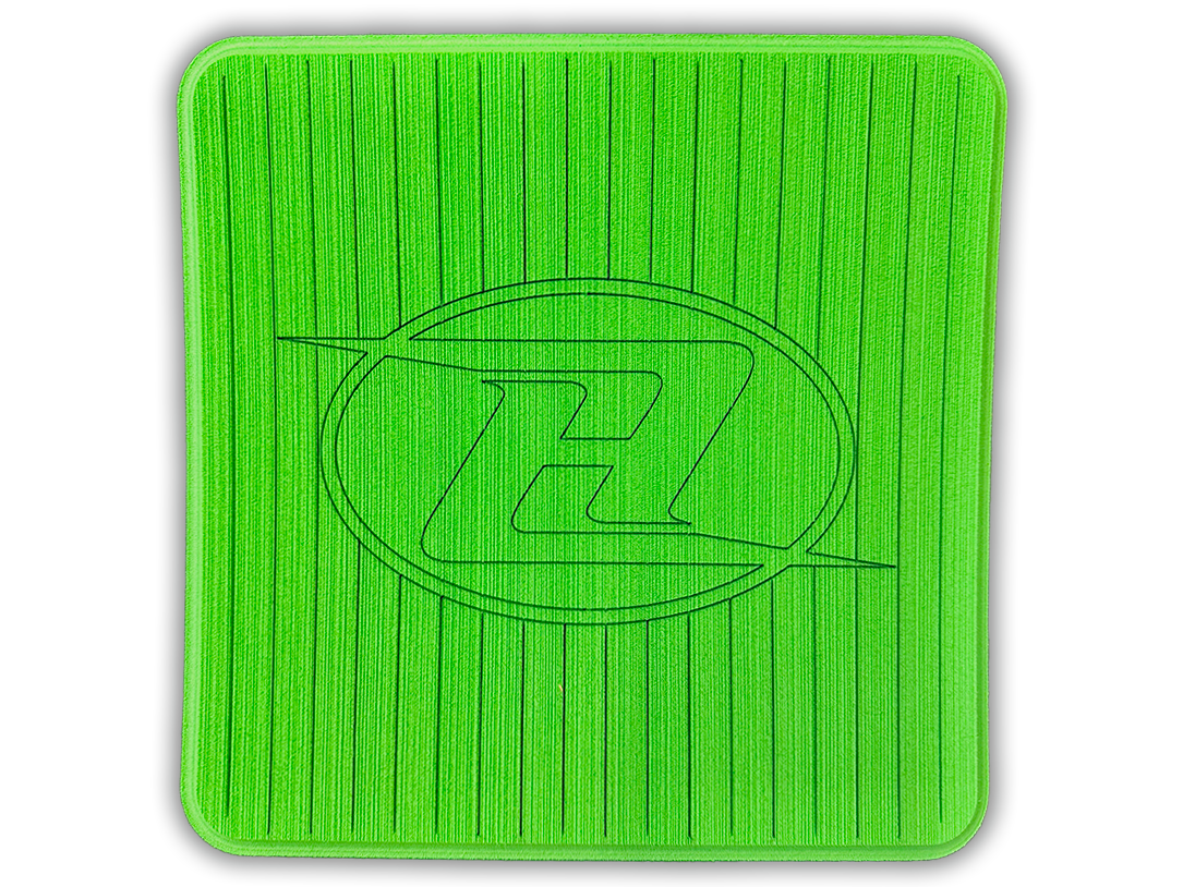 Square deck grip patch with vertical ridges and oval logo, neon green.