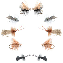 Assorted dry fishing flies, mixed tan, brown, and black patterns with barbed hooks