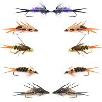 Assorted wet fly lures: blue-wing pair, orange tail flies, and brown fuzzy bodies on hooks.