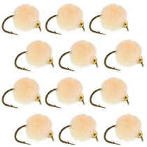 Twelve light tan foam egg fly fishing lures with dark hooks and bead heads