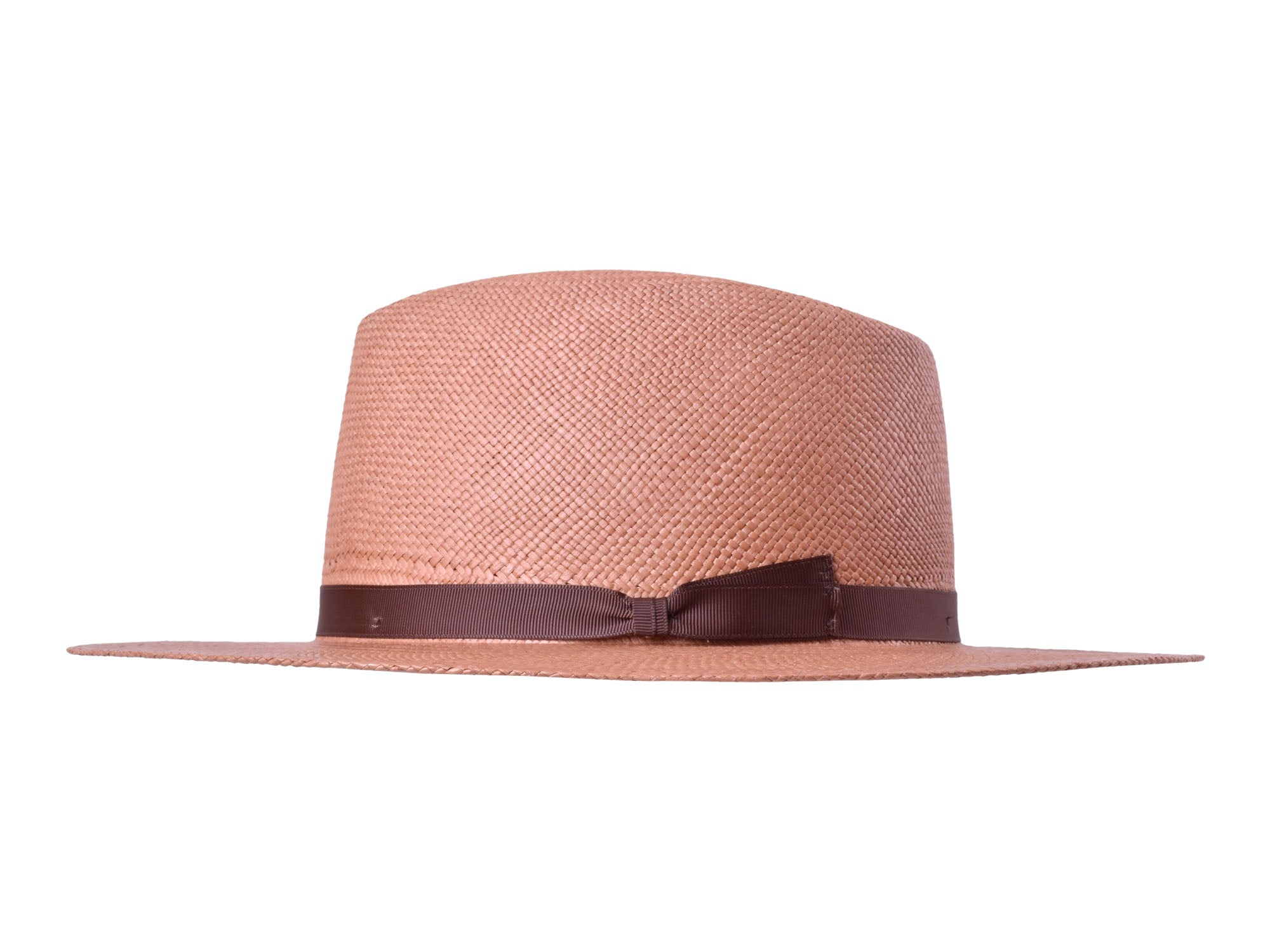 Pink woven Panama hat with dark brown band, side profile view.
