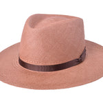 Pink woven Panama hat with dark brown band, wide brim, front 3/4 view.