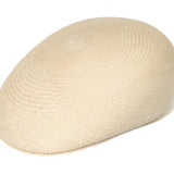 Natural straw Panama-style ascot hat with rounded crown and short brim.